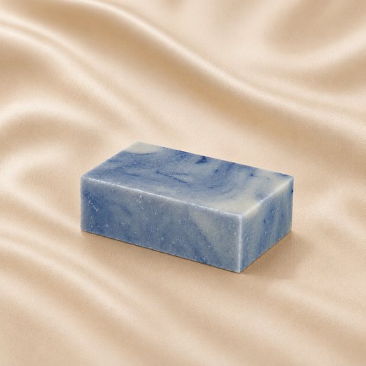 Mae Luna Cypress Lavender blue marbled botanical soap bar on cream satin.